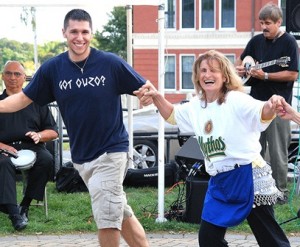 Monthe Lofos and Nikki Beander, both parishioners of Sts. Anargyroi Church, dance along with live music at a past Grecian Festival. File photo/Ed Karvoski Jr. 