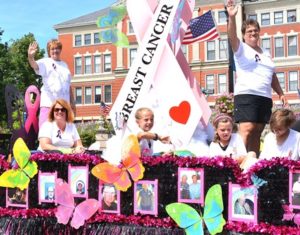 Four-time cancer survivor Vikki Crowley (standing, left) and Team Vikki ride on a float that won the Grand Marshal’s Trophy for best overall. Their theme this year was “Gone, but not forgotten.”