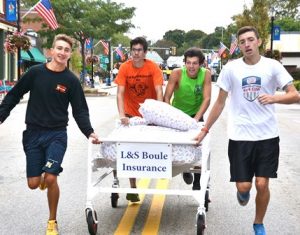 Racing toward first-place victory is the team sponsored by L&S Insurance consisting of Marlborough High boys cross country runners (l to r) Brian Oram, Yossef Naim, Matt Pearl and Austin Wise.