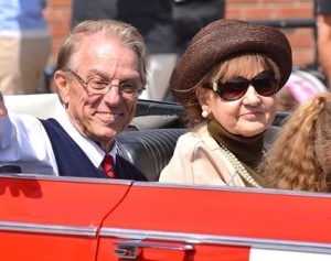 Walter Bonin and his wife, Joanne, ride in a convertible as he’s honored as grand marshal.