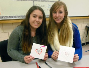 Amanda Cameron and Jennifer Marino, MHS Student Council members in 10th grade, make Valentine's Day cards for the American troops in Qatar. Photo/Nance Ebert