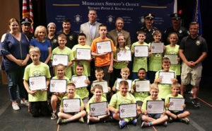 Marlborough Cadets with officials from the Middlesex Sheriff’s Office and city officials Photos/submitted