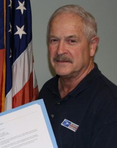 Two employees honored for decades in postal service