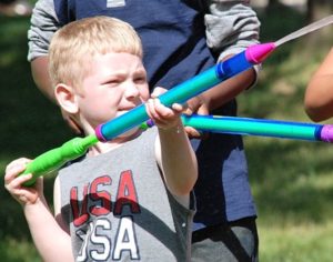 Dylan Scricco, 5, aims to squirt a germy target.