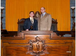 Danillo Sena (l), the new district director to State Sen. Jamie Eldridge, D-Acton, poses for a photo with the senator at the Statehouse in Boston. (Photo/submitted)