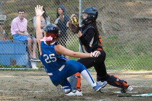 Marlborough catcher Victoria Petrie gets a Leominster runner out on a force play at home plate.