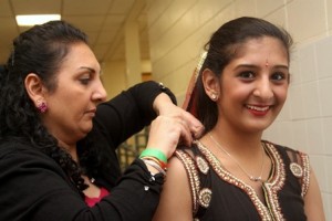 Manraj Bimrah, right, of Westborough, gets some help from her mother, Daljit, before performing.