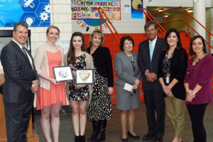 (l to r) Mayor Arthur Vigeant, first-place winner Kate Greenlaw, second-place winner Maegan Moynihan, Youth Commission Member Kelley French, MHS Principal Wendy Jack, Superintendent Richard Langlois, Youth Commission Member and MHS guidance counselor Sharon Buckley, and MHS Visual Arts Coordinator Julie Baker.