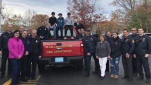 Members of 1714 IAFF and their families pose for a photo before delivering Thanksgiving dinner to members of the community. 