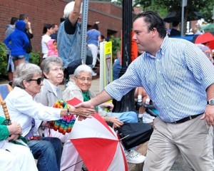 Steve Kerrigan, a Democratic candidate for lieutenant governor, mingles along the parade sidelines.
