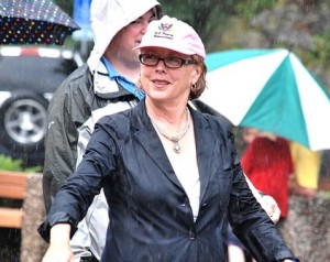 U.S. Rep. Niki Tsongas, D-3rd District, marches through one of several of the day's sudden downpours.