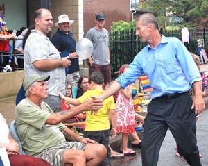Meeting parade spectators is state Rep. Tom Conroy, D-Wayland, of the 13th Middlesex District, which includes four precincts in Marlborough. 