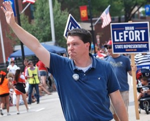 Marching with supporters is Brian LeFort, a Democratic candidate for 13th Middlesex state representative.
