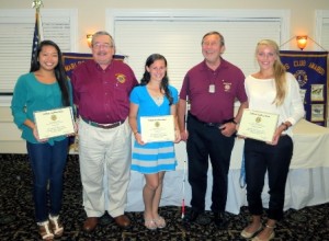 Winners of the Lions Club scholarships, (l to r) Loan Vuong, Brittney Lutz, and Kendra Harrington with Scholarship Chair Bob Page (left) and Club President John Usinas.