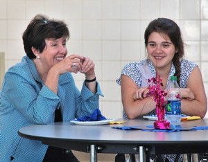 Charlotte Broussard and Nicole Wynne share a laugh at a luncheon Aug. 14 for employers and students who participated in this summer's youth jobs program. Photo/Ed Karvoski Jr. 