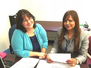 Tina Nolan (left) senior clerk at the Marlborough Board of Health Office, assists Community Health Worker Sara Oliveira in scheduling appointments for seniors requesting home visits. (Photo/submitted)