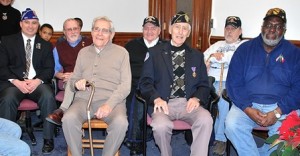 Honored at a ceremony Dec. 16 at City Hall are Purple Heart recipients from Marlborough: (l to r) Ed Jolley, Usy Cormier, Louis Monti, Ross Flagg, Henry Marchant, Jerry Elliott and Jim Winbush. Photo/Ed Karvoski Jr. 
