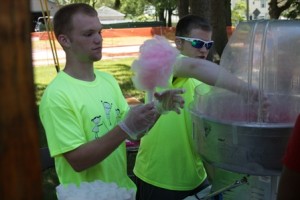 Two young volunteers, Patrick Spicer and Zachary Jackson, local sophomores, hand out free cotton candy.