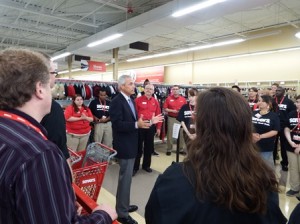 Ken Alterman, the president and CEO of Savers, Inc., speaks with the Marlborugh store employees before the store opens. 
