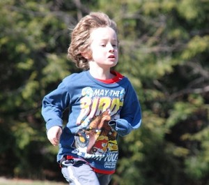 Second-grader Alexander Todd runs laps.