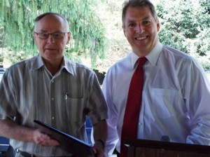 Mayor Arthur Vigeant (right) presents the prestigious Veteran of the Year award to George Whapman at a special ceremony August 3 at the Fish and Game Club.    Photo/submitted