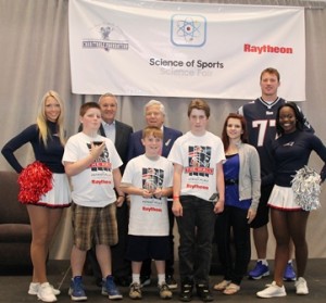 Marlborough 1 poses with members of the New England Patriots organization including owner Robert Kraft.  