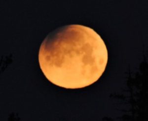 Moon shines in red over region in rare lunar event