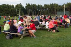  Diners enjoy the food at the Applefest barbecue before the fireworks show. 