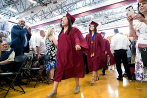 Graduates march into the Algonquin Regional graduation ceremony while being cheered on by friends and family. Photo/Jeff Slovin
