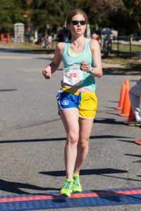 Kristen Flajslik of Hopkinton crosses the finish line as the first female finisher, with a time of 19:48 in the Applefest 5K. Photo/Jeff Slovin