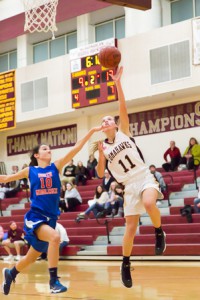 Algonquin senior Kendyl Finelli (#11) shoots over North Middlesex sophomore Grace Young (#10) early in the second quarter. 