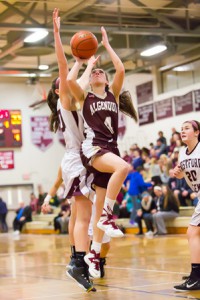 Algonquin senior Julia Insani (#4) goes up to shoot in the Feb. 25 game against Westford