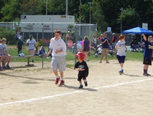Liam Fitzgerald runs to home plate with his buddy Aidan Lowe.