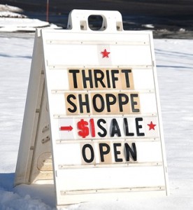 The Thrift Shop advertises a dollar sale.