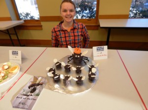 2nd prize winner Maura Mulligan with her edible book, “Lord of the Flies”