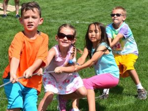 Competing in a tug of war are (l to r) Ashton Bates, 7, his sister Juliet, 5, Niko Conway, 7, and Landin Youssef, 9.