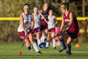 Algonquin’s Grace Antino (#15) brings the ball downfield while being defended by Westborough’s Olivia Weckwerth (#16). 