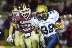 Shrewsbury’s Timothy Rioux (#38) carries the ball as he is pursued by Algonquin’s Nathan Cooley (#52).