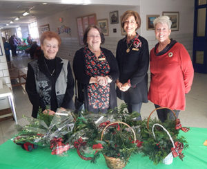 (l to r) Francesca Bombara, Ann Webster, Suzanne McCance and Kathleen Devericks pose for a photo at the Northborough Garden Club’s annual Holiday Enchantment event held Dec. 1 at the Marguerite E. Peaslee Elementary School.   Photo/Melanie Petrucci 