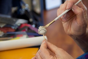 An artist works with silver metal clay. Once fired this bead will be pure silver. (Photo/Heart and Stone Jewelry)
