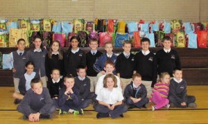 St. Bernadette’s School students collected donations to make Thanksgiving food bags for seniors. (Photos/submitted)