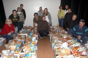 Members of Northborough Helping Hands with donated Thanksgiving gift baskets that will be distributed to those in need.   Photo/John Swinconeck 