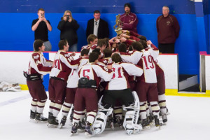 The Algonquin Regional boys ice hockey team celebrates after winning the Boro's Cup trophy. 