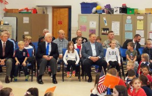 Students and their military relatives and friends watch the Veterans’ Day presentation.