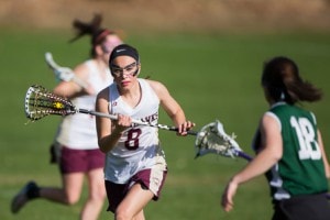 Algonquin’s Jessie DeLouis carries the ball during a game against Wachusett