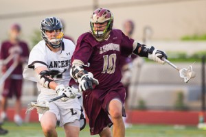 Algonquin senior Mike Martens (#10) races towards the goal while being pursued by Longmeadow defender Rocco Casaceli.