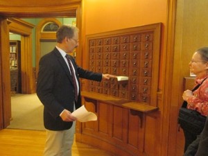 Library Director Christopher Lindquist demonstrates how the card catalog was once used.