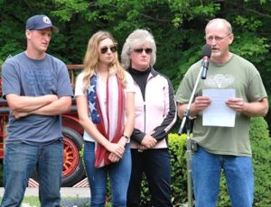 Daniel Arsenault (right) speaks about his son U.S. Army Spc. Brian K. Arsenault with support from loved ones: (l to r) his future son-in-law Brandon Johnson, daughter Lindsey and wife Leslie.