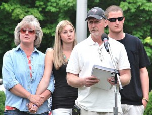 Daniel W. Arsenault (front) speaks about his son, U.S. Army Spc. Brian K. Arsenault, with support from (back l to r) his wife Leslie, their daughter Lindsey and her boyfriend Brandon Johnson.
