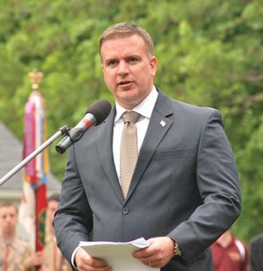 Adam Costello, director of Central Massachusetts Veterans’ Service District, speaks at the Veterans Memorial in the Howard Street Cemetery. 
